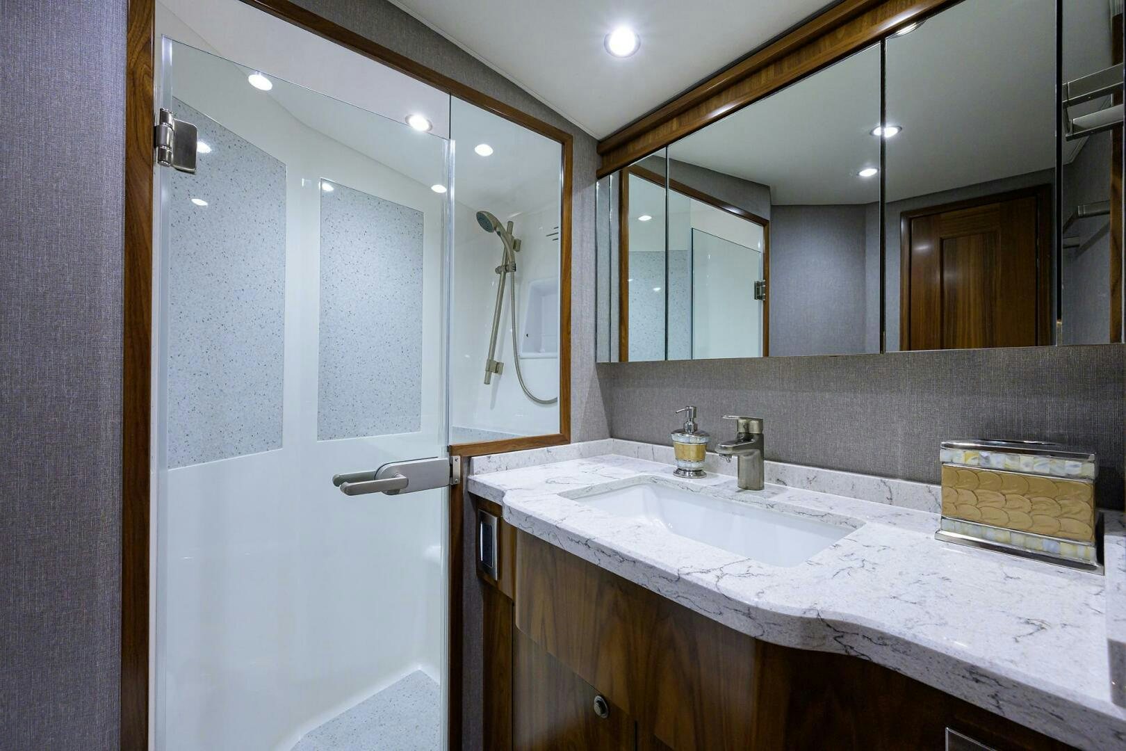 a bathroom with a large mirror aboard SNOWBIRD Yacht for Sale