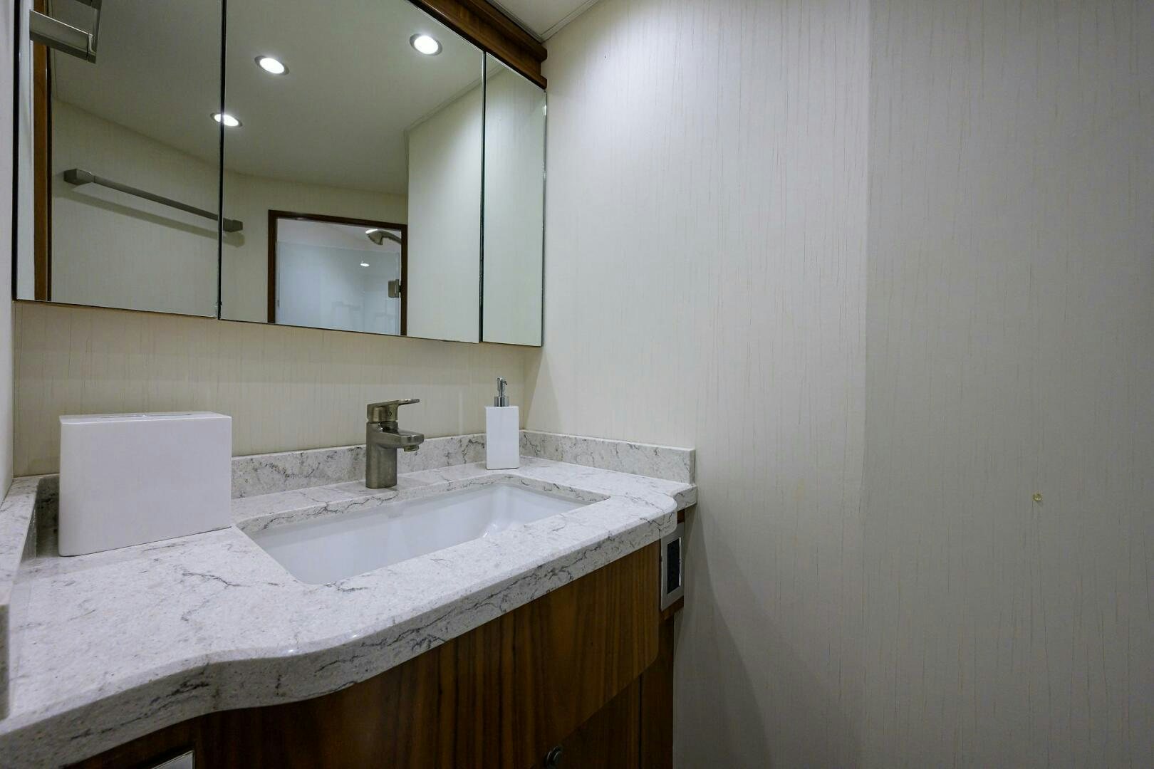 a bathroom with a mirror aboard SNOWBIRD Yacht for Sale