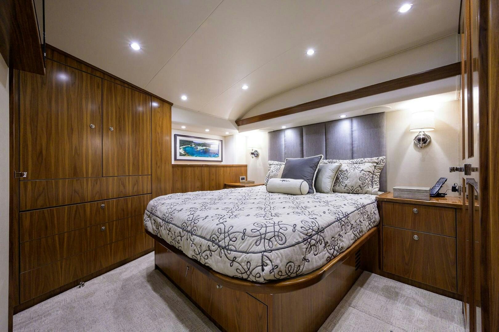 a bedroom with a bed and a wood wall aboard SNOWBIRD Yacht for Sale