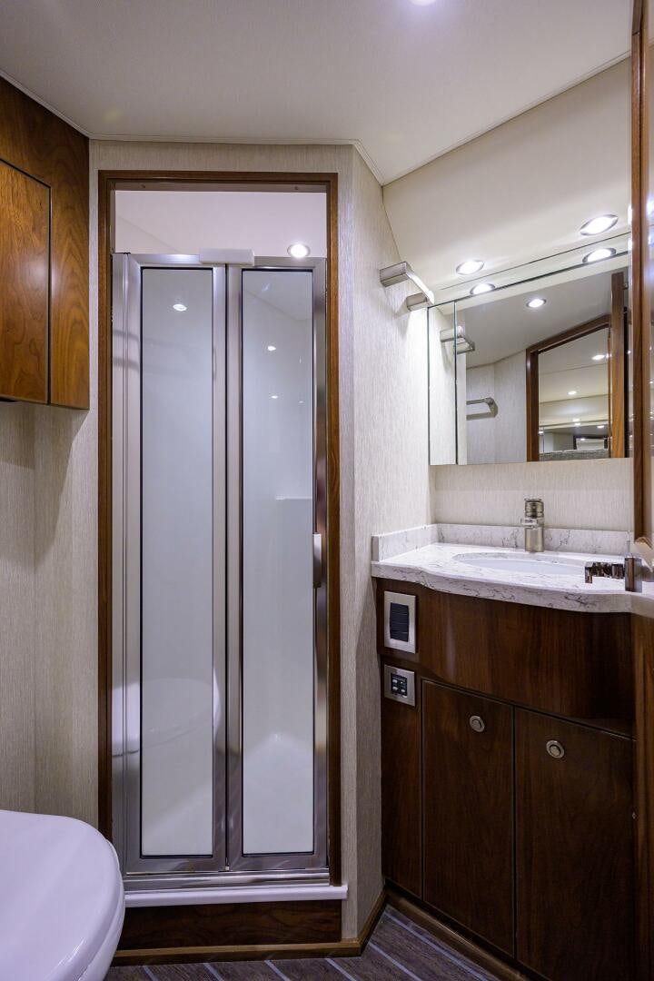 a bathroom with a shower unit and sink aboard SNOWBIRD Yacht for Sale