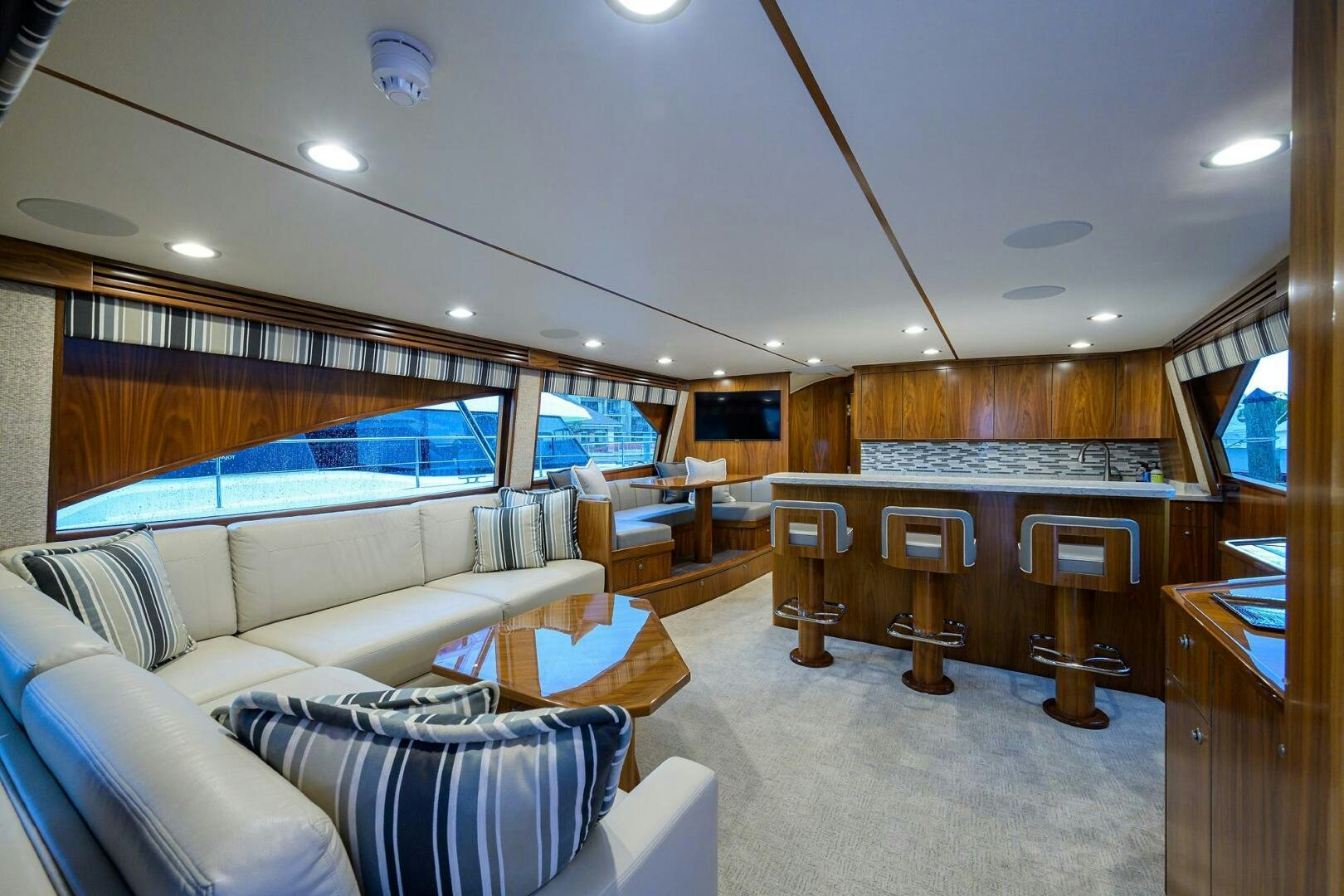 a living room with a large window aboard SNOWBIRD Yacht for Sale