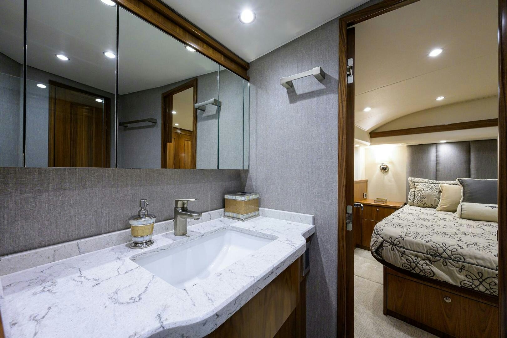 a bathroom with a large mirror aboard SNOWBIRD Yacht for Sale