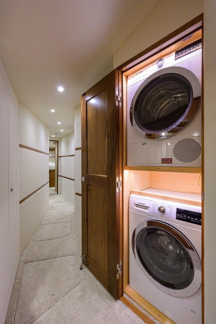 a washer and dryer in a laundry room aboard SNOWBIRD Yacht for Sale