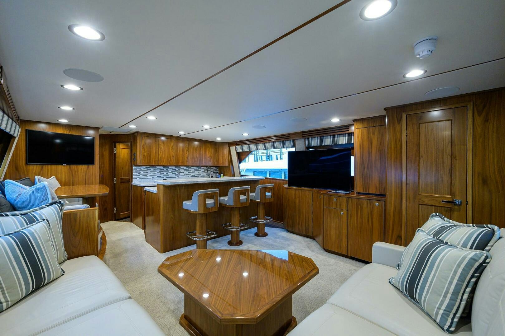 a room with a bed and a table aboard SNOWBIRD Yacht for Sale