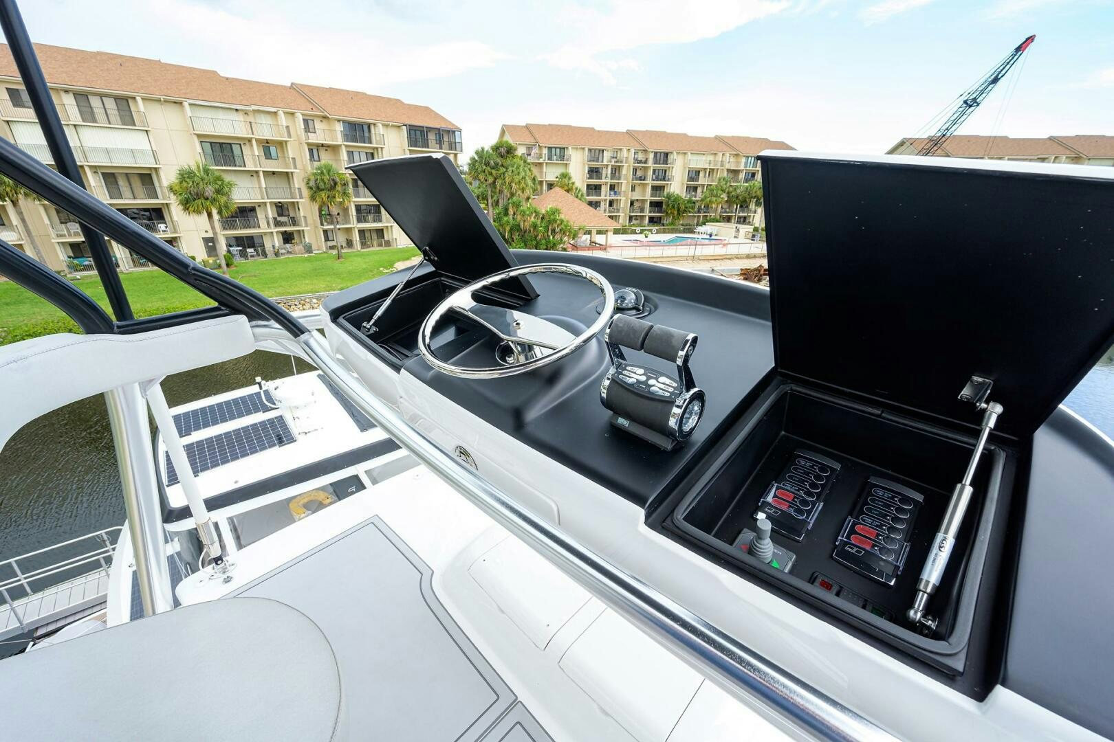 a steering wheel and dashboard of a car aboard SNOWBIRD Yacht for Sale