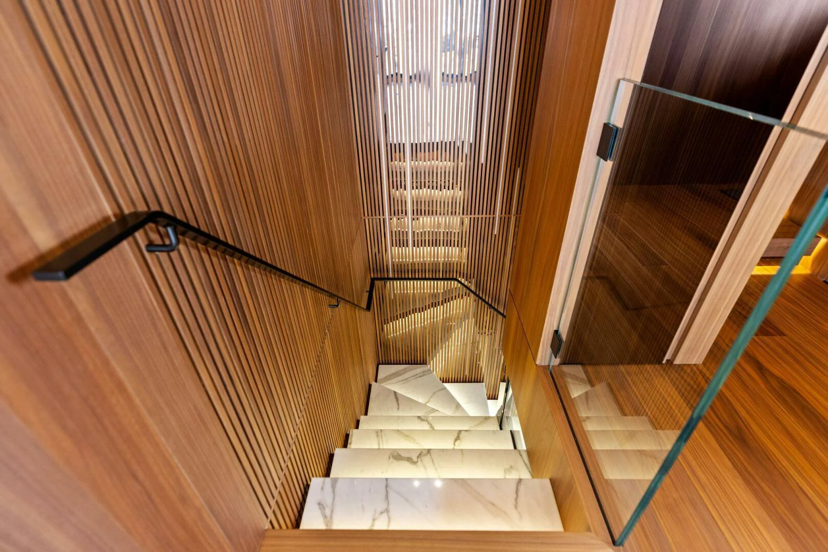 a staircase with a railing aboard KAMAKASA Yacht for Sale