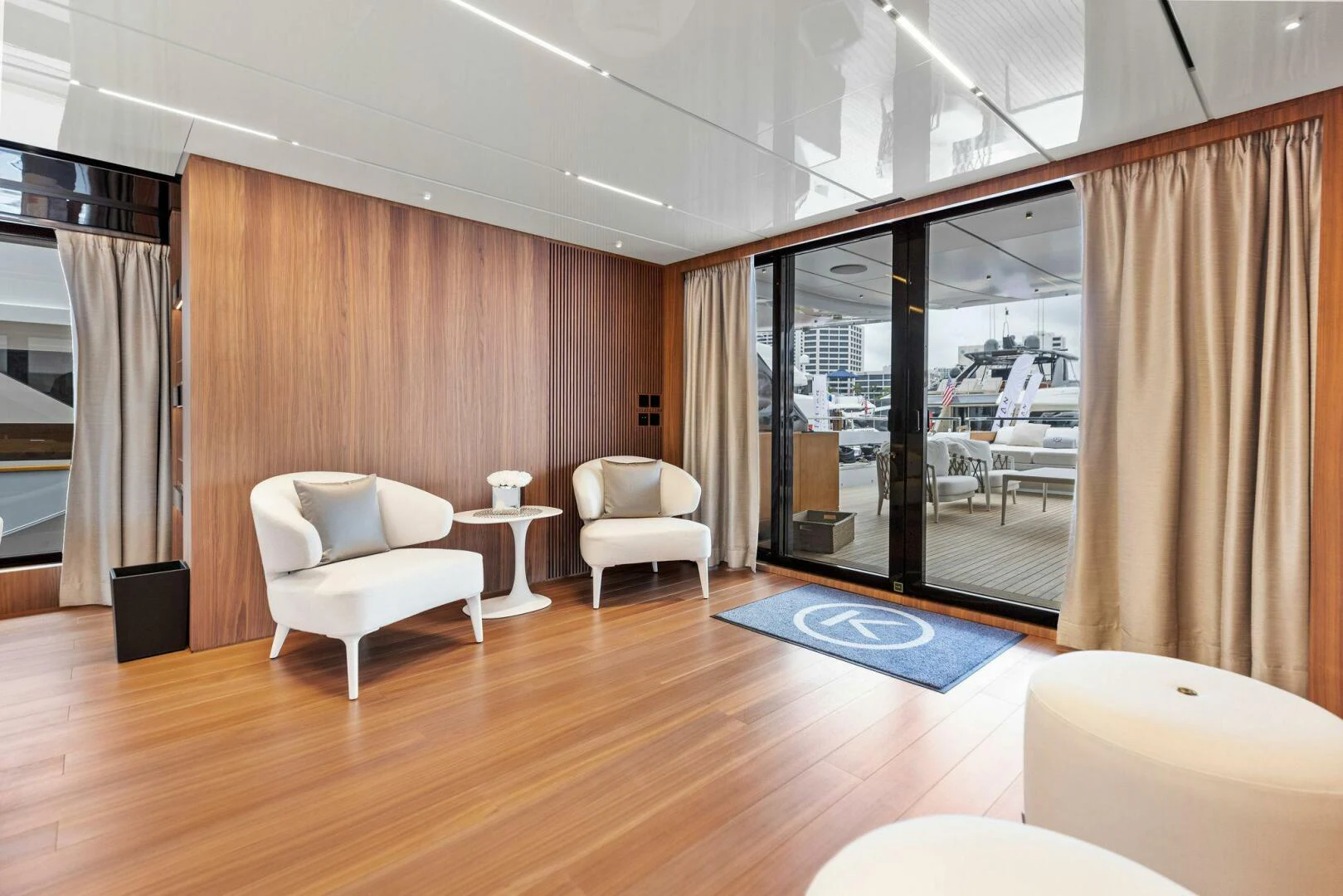 a room with a wood floor and a large window aboard KAMAKASA Yacht for Sale