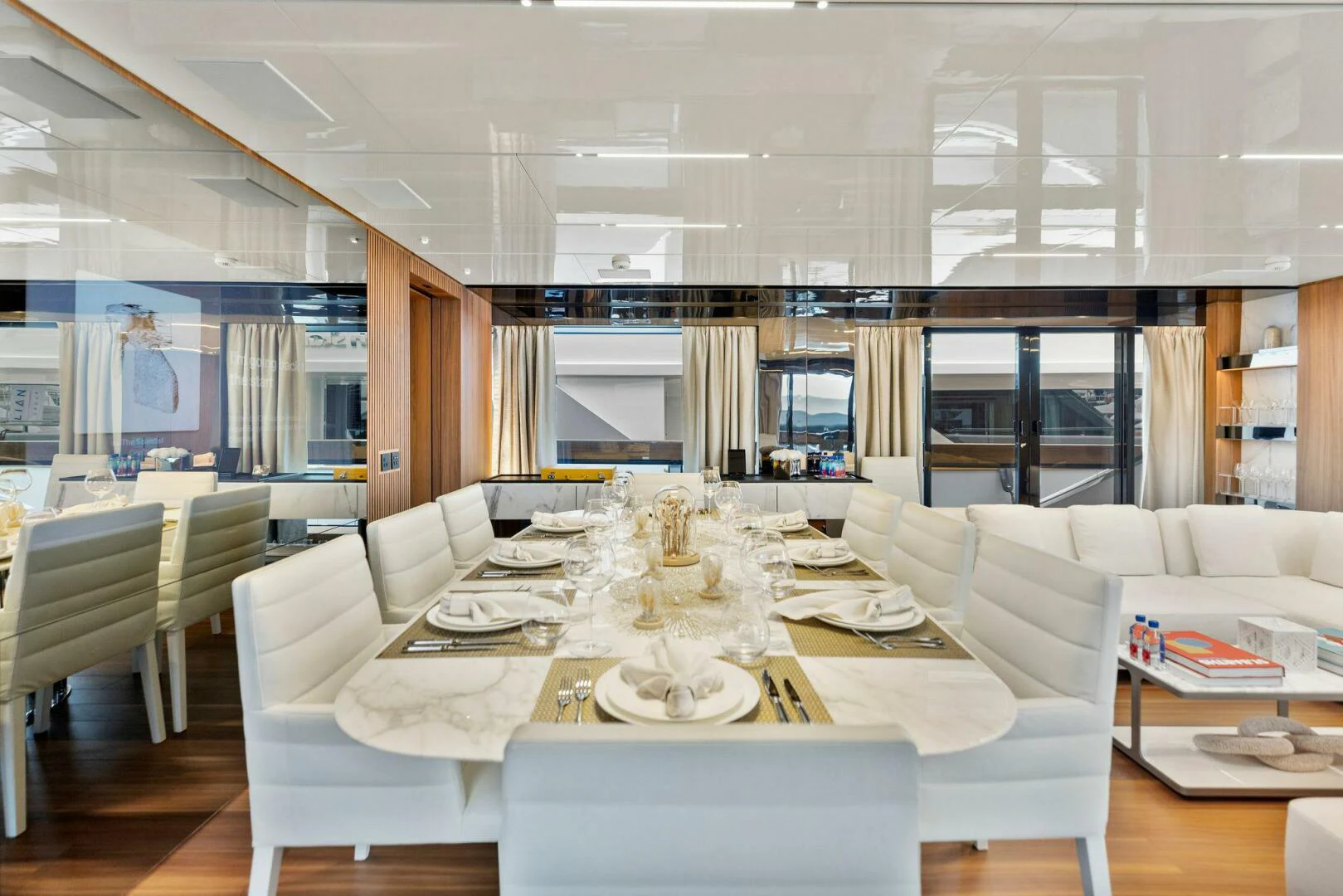 a large room with a table and chairs aboard KAMAKASA Yacht for Sale