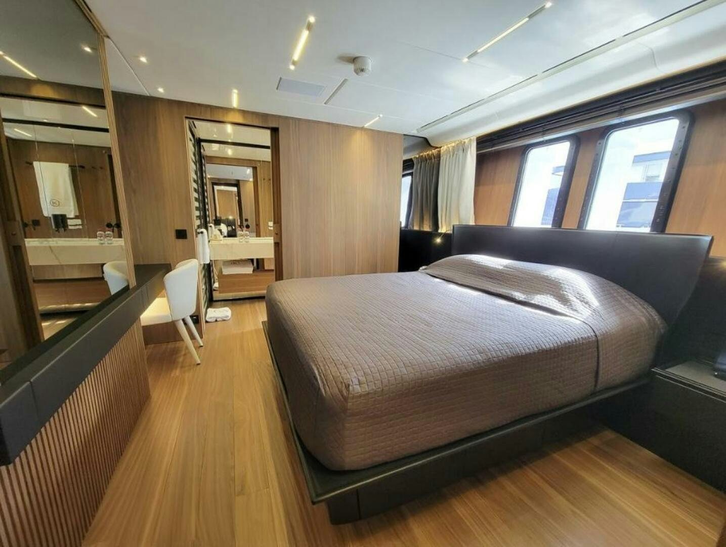 a bed in a room aboard KAMAKASA Yacht for Sale