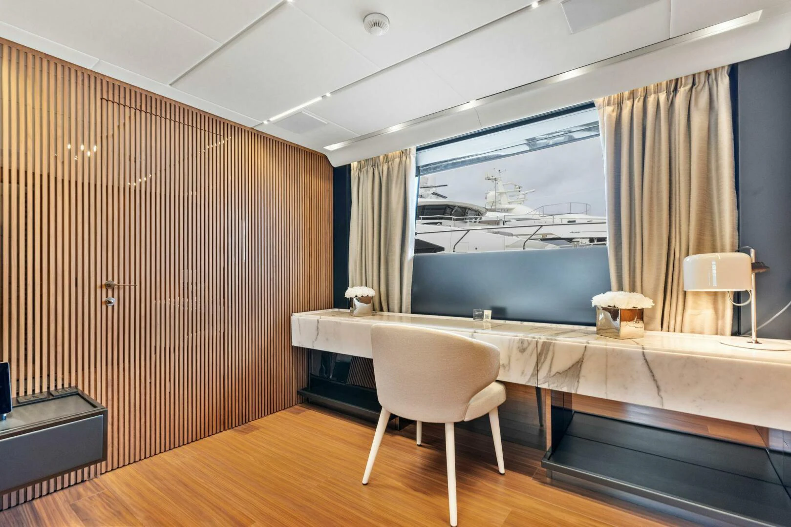 a room with a large window aboard KAMAKASA Yacht for Sale