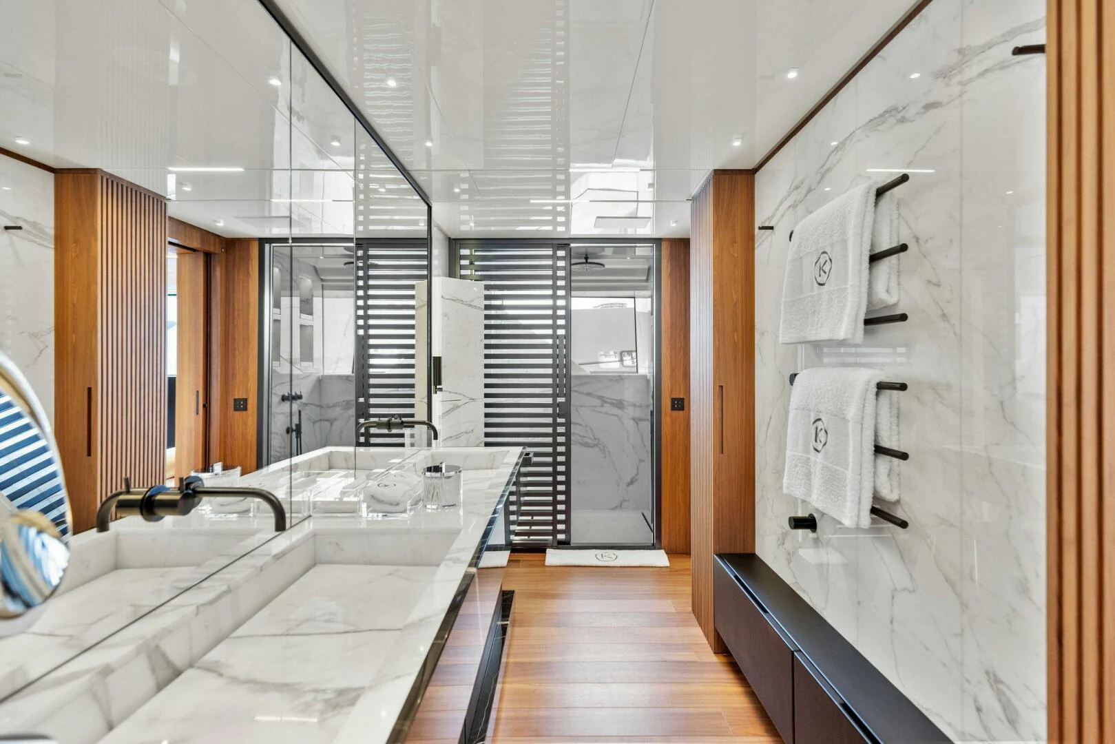 a bathroom with a large glass shower aboard KAMAKASA Yacht for Sale