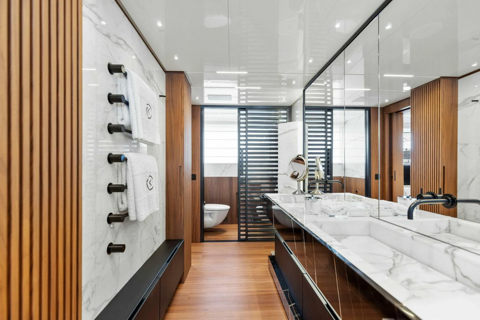 a bathroom with a tub sink and toilet aboard KAMAKASA Yacht for Sale