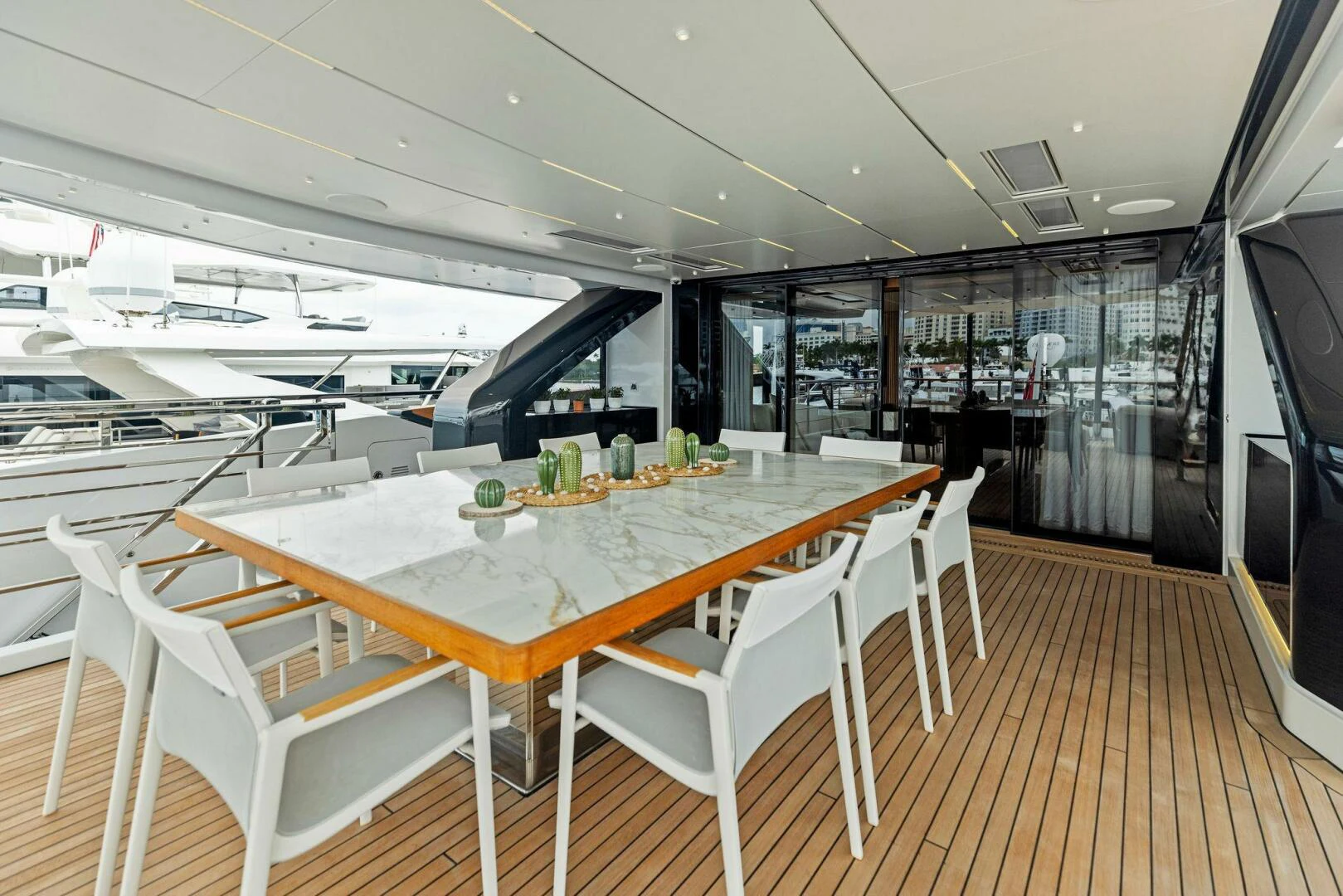 a large room with a table and chairs aboard KAMAKASA Yacht for Sale