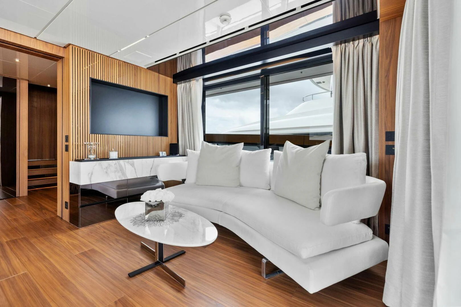 a room with a large television and a bed aboard KAMAKASA Yacht for Sale