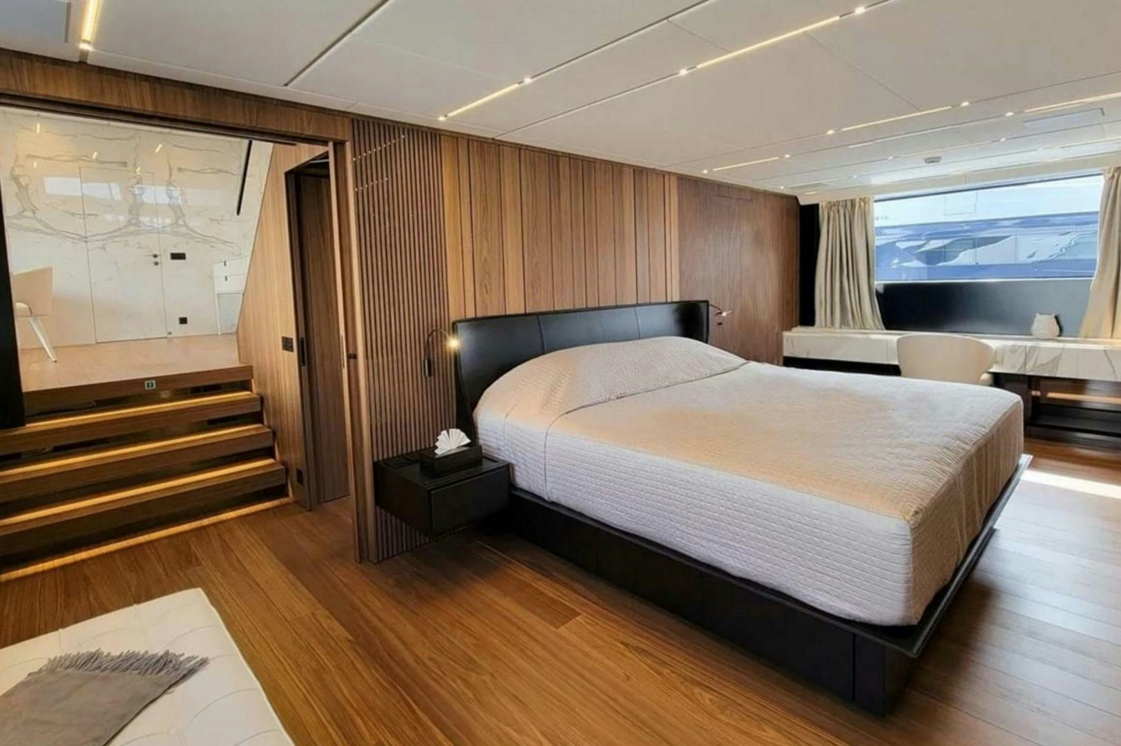 a large bed in a room aboard KAMAKASA Yacht for Sale