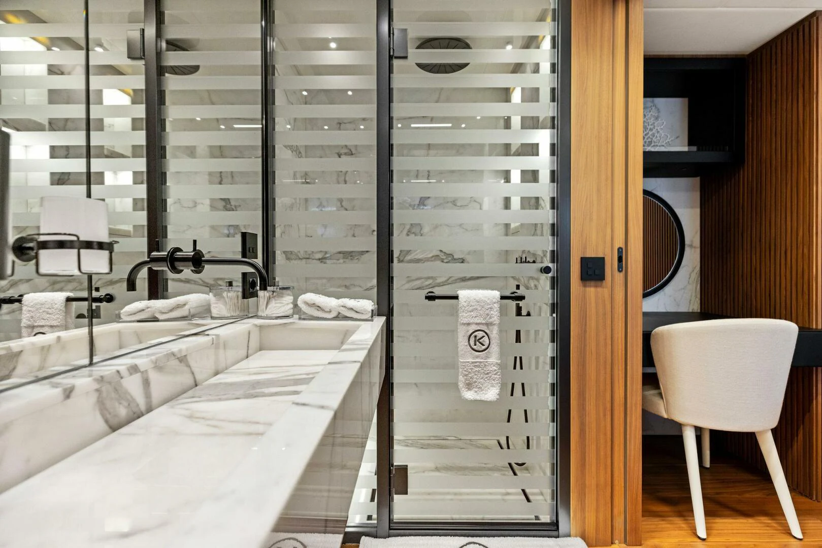 a bathroom with a large mirror aboard KAMAKASA Yacht for Sale