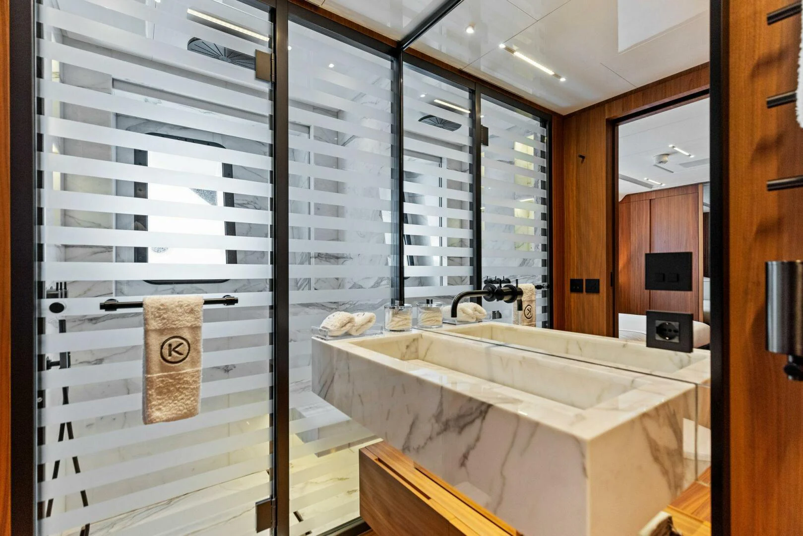 a bathroom with a tub and a sink aboard KAMAKASA Yacht for Sale