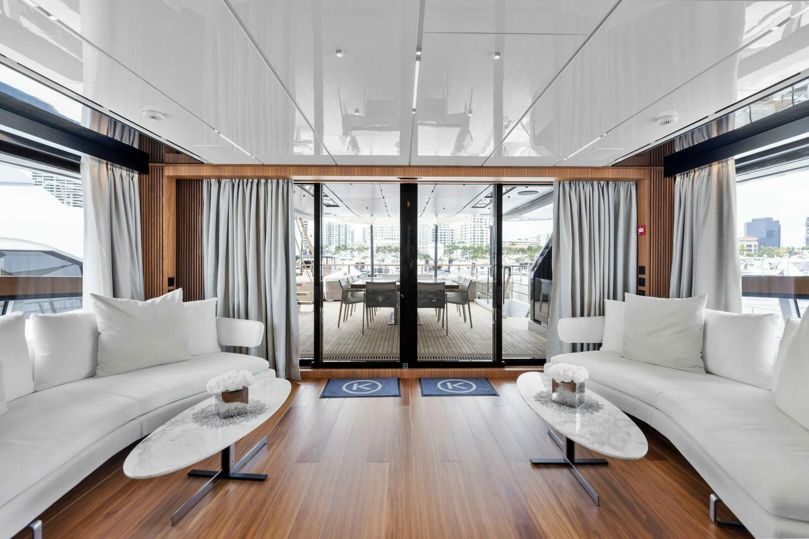 a living room with a large window aboard KAMAKASA Yacht for Sale