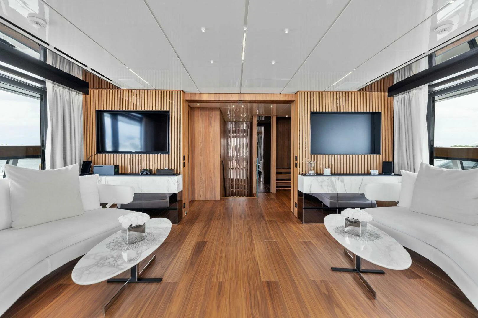 a living room with a wood floor aboard KAMAKASA Yacht for Sale