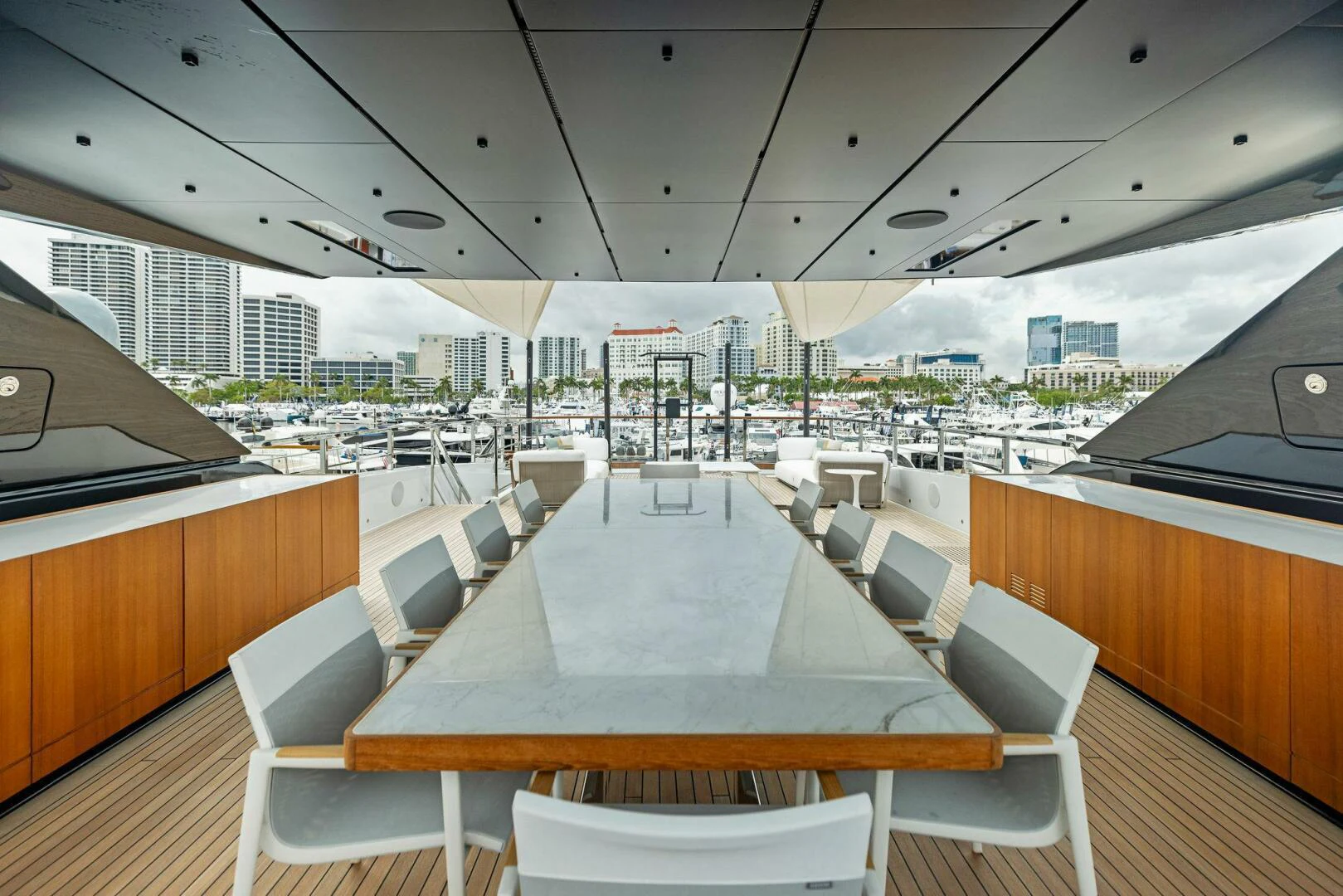 a large room with tables and chairs aboard KAMAKASA Yacht for Sale