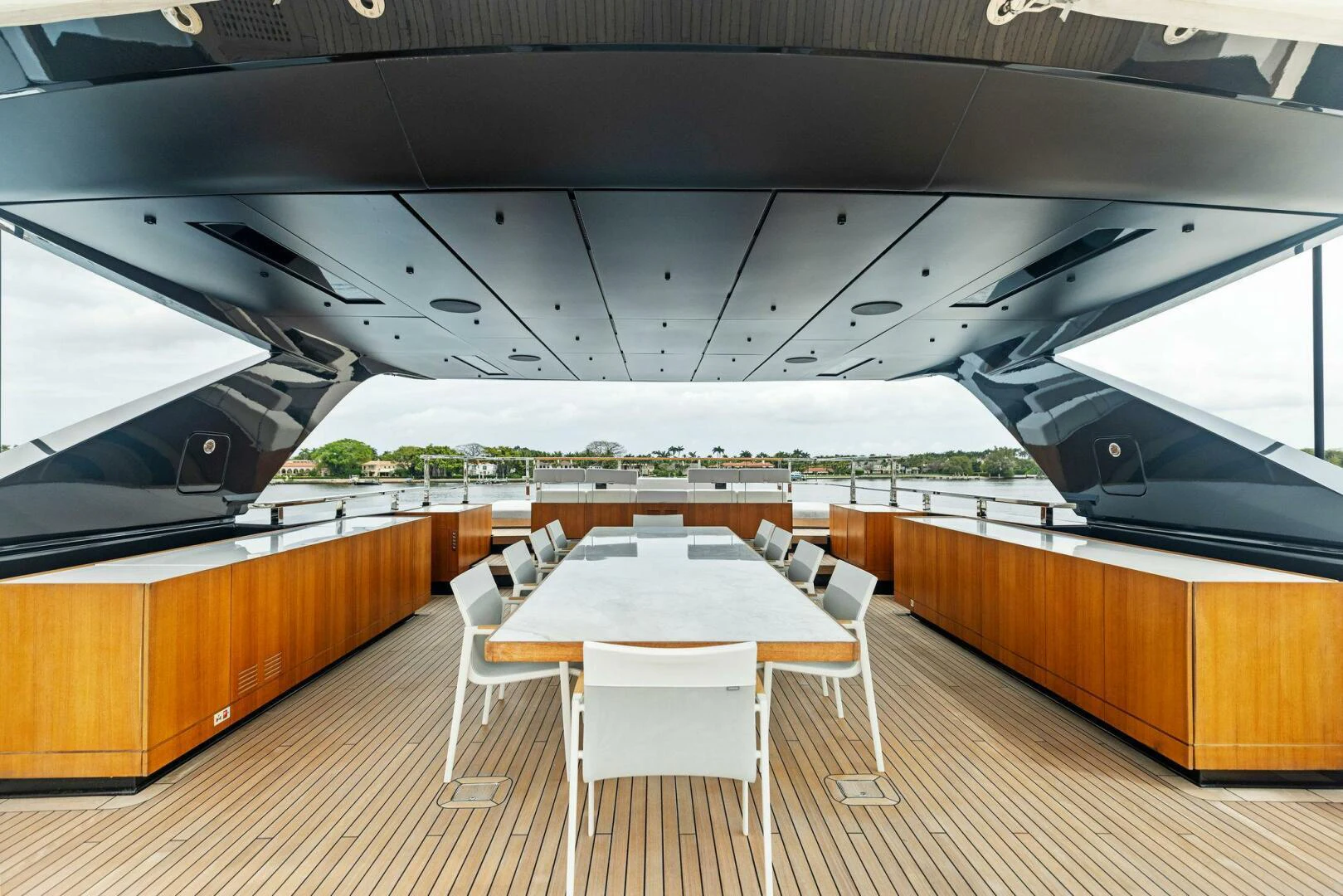 a room with tables and chairs aboard KAMAKASA Yacht for Sale
