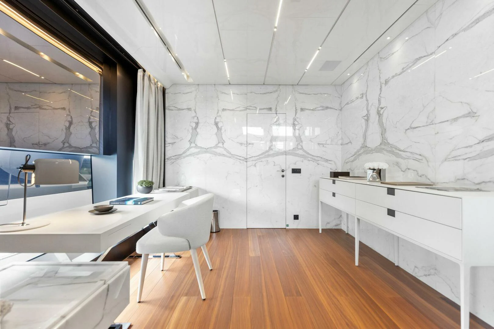 a room with a table and chairs aboard KAMAKASA Yacht for Sale