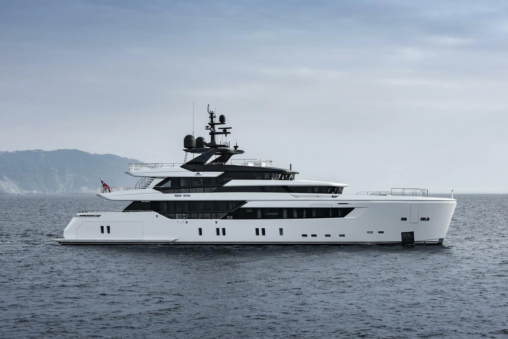 a white yacht in the water aboard KAMAKASA Yacht for Sale