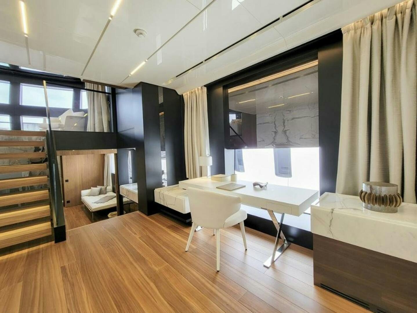a room with a table and chairs aboard KAMAKASA Yacht for Sale