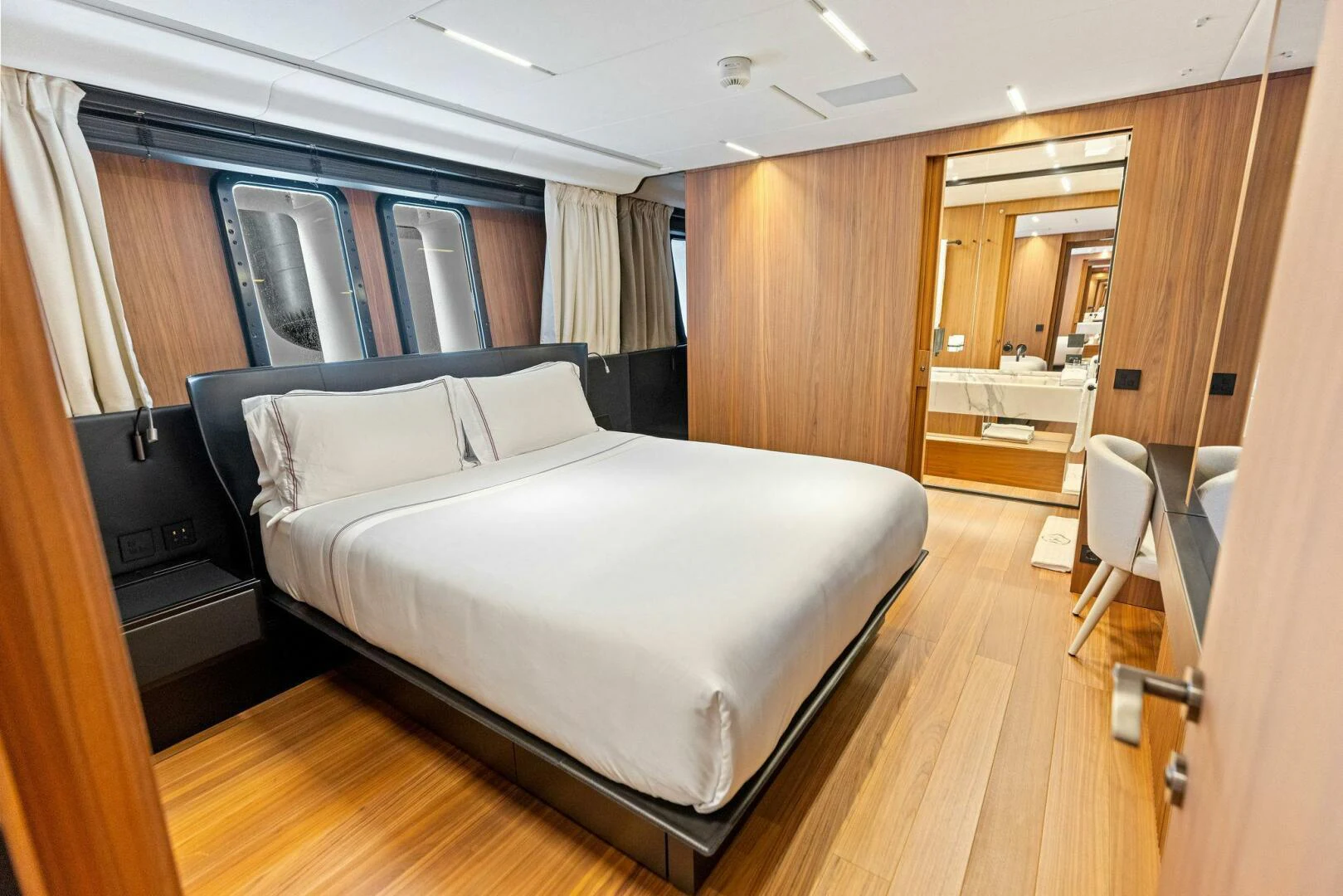 a bed in a room aboard KAMAKASA Yacht for Sale