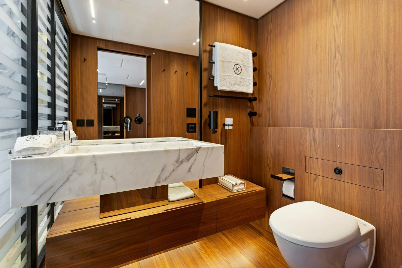 a bathroom with a tub and toilet aboard KAMAKASA Yacht for Sale