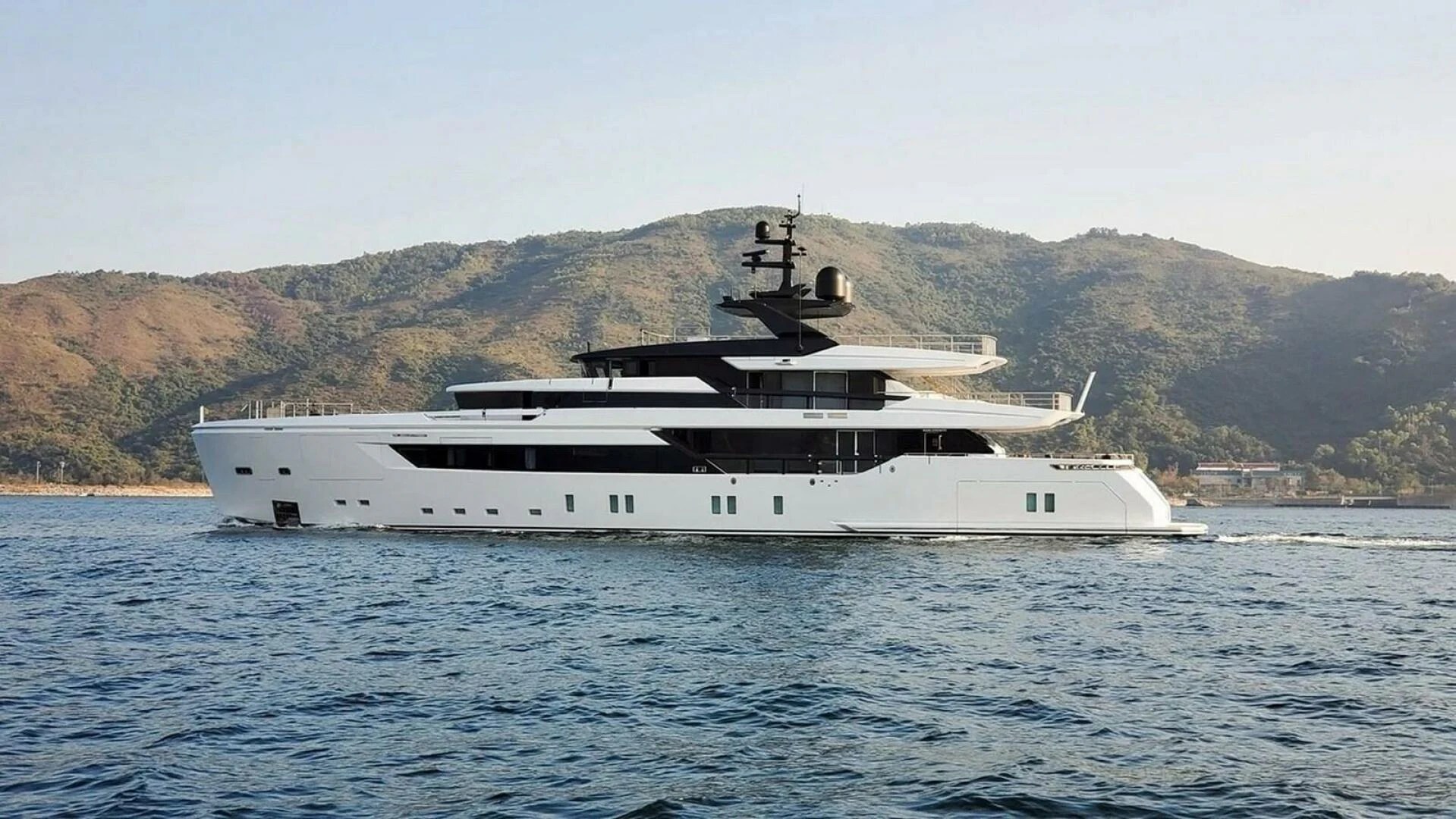 a large white boat in the water aboard KAMAKASA Yacht for Sale