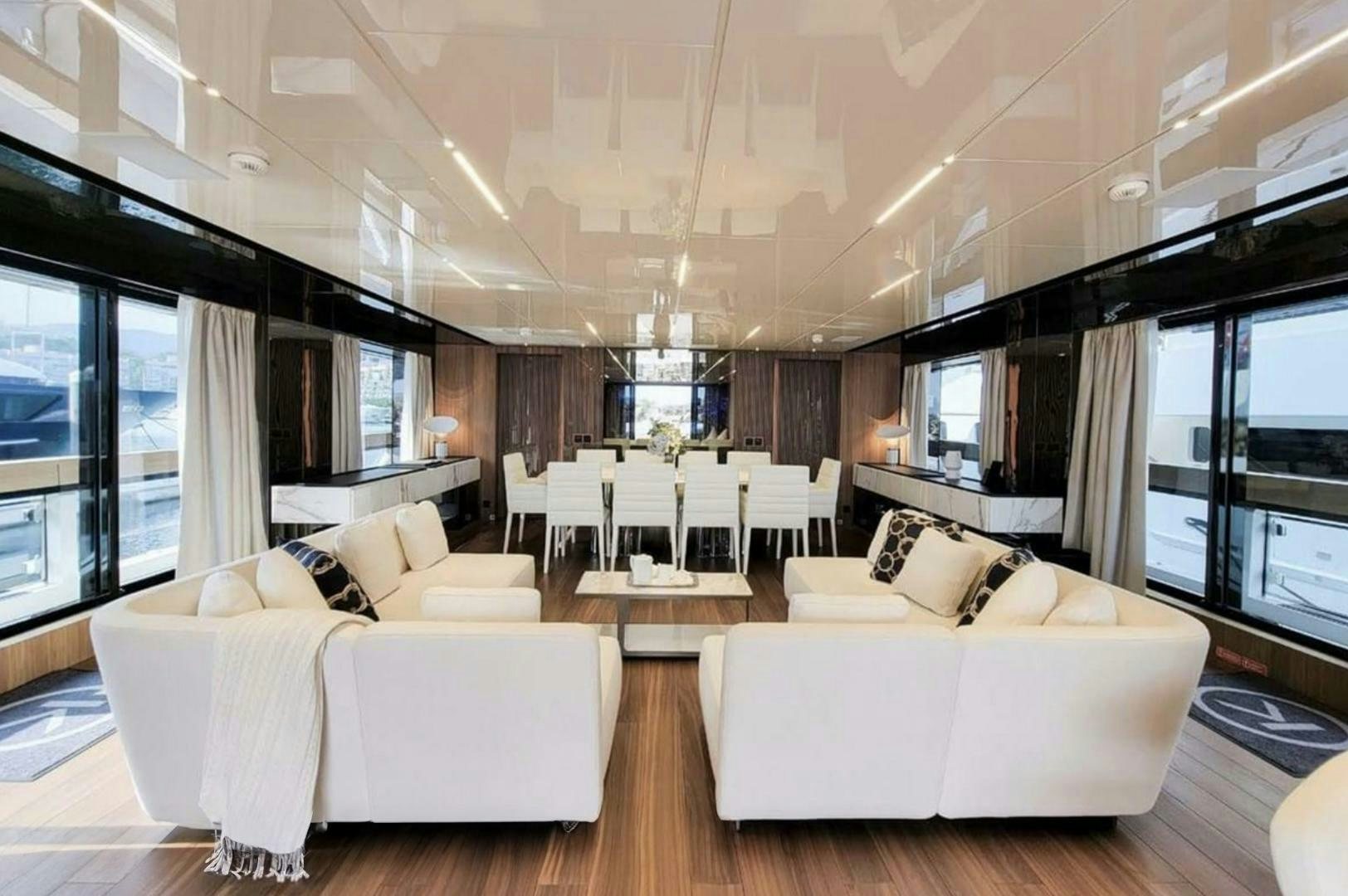 a room with a couch and a table and chairs aboard KAMAKASA Yacht for Sale