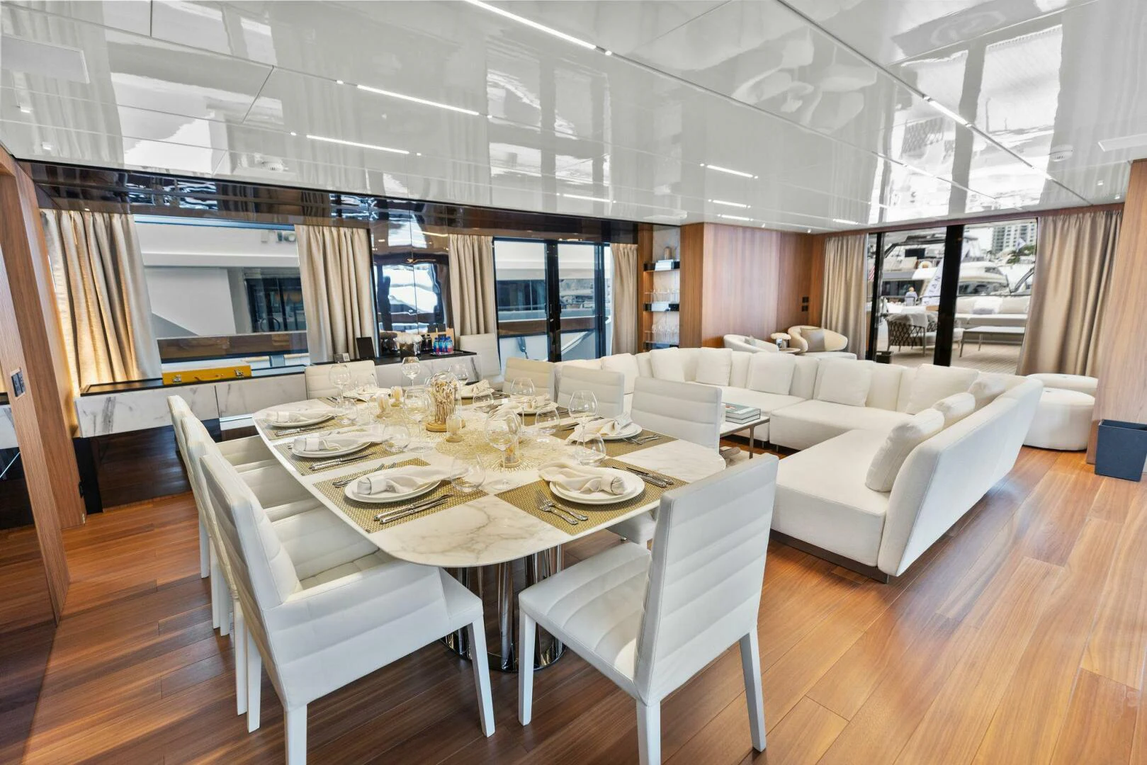 a large room with a table and chairs aboard KAMAKASA Yacht for Sale