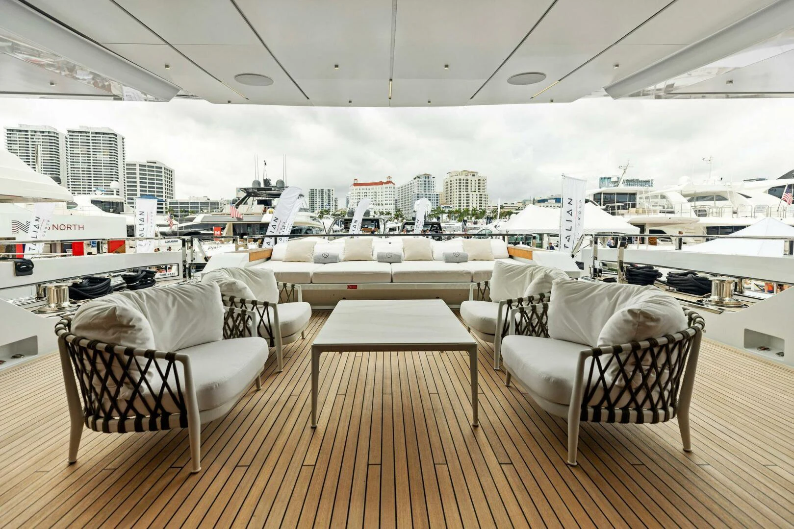 a table and chairs on a deck aboard KAMAKASA Yacht for Sale