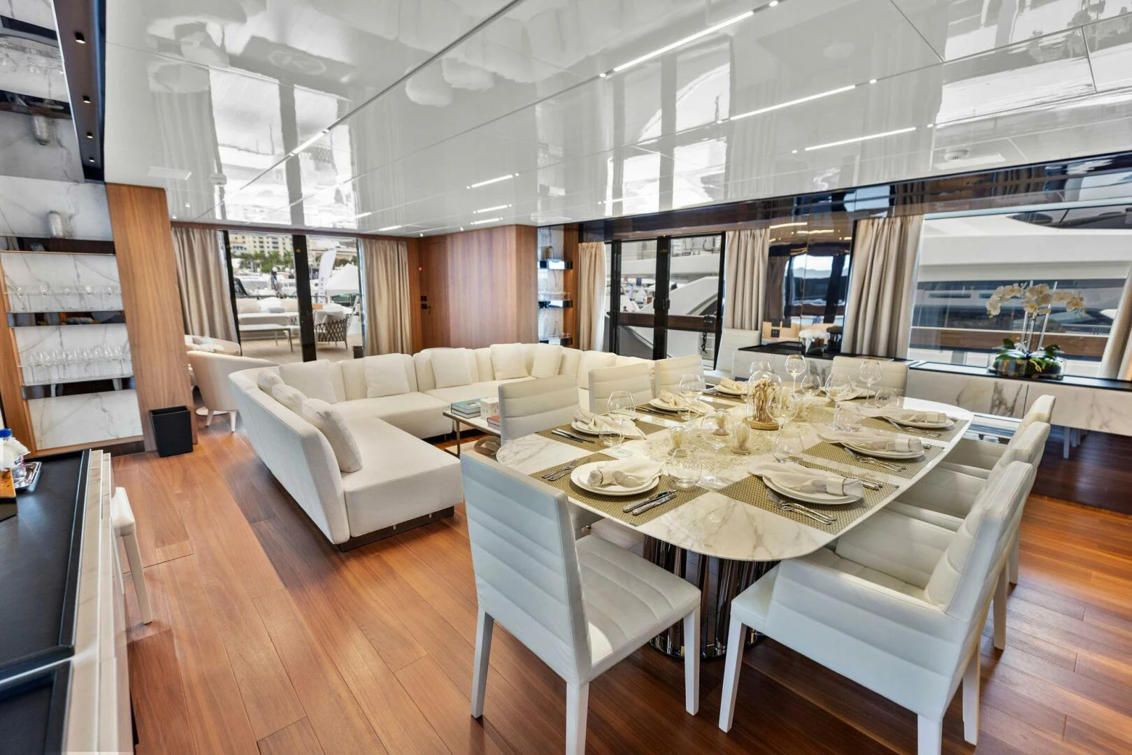 a large room with a table and chairs aboard KAMAKASA Yacht for Sale