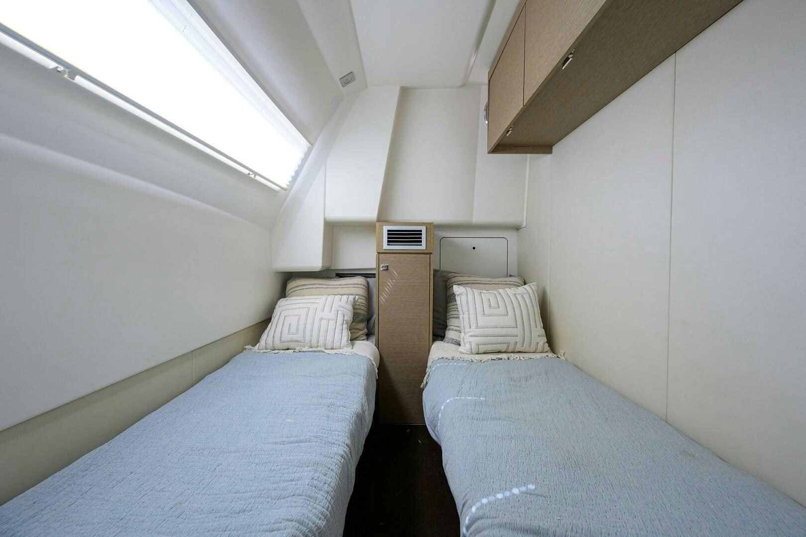 a couple of beds in a room aboard 2016 68 PRESTIGE Yacht for Sale