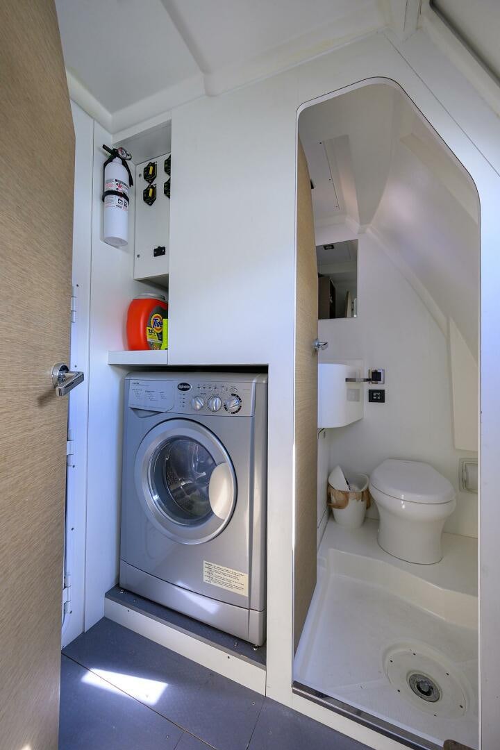 a washer and dryer in a room aboard 2016 68 PRESTIGE Yacht for Sale