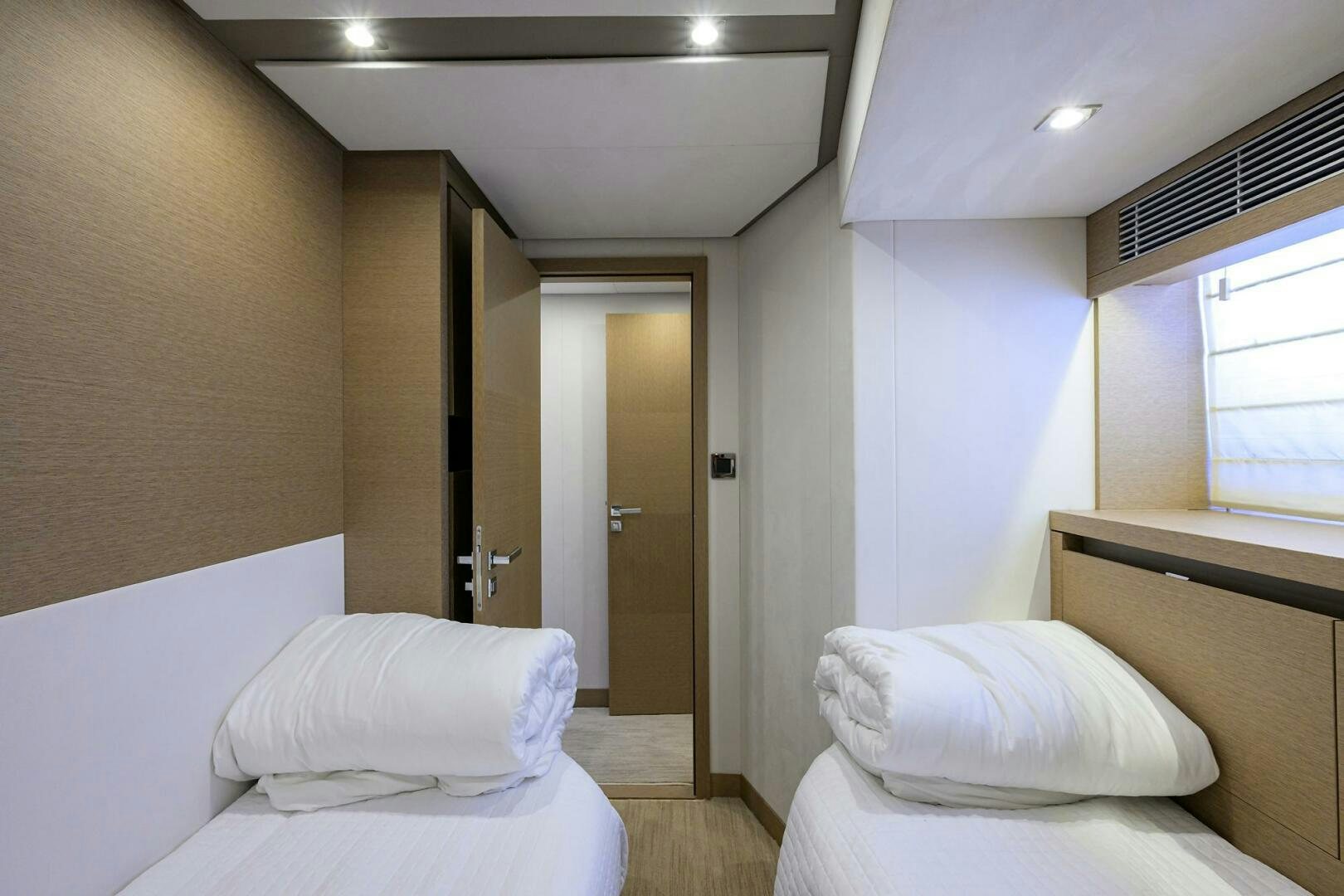 a room with two beds aboard 2016 68 PRESTIGE Yacht for Sale