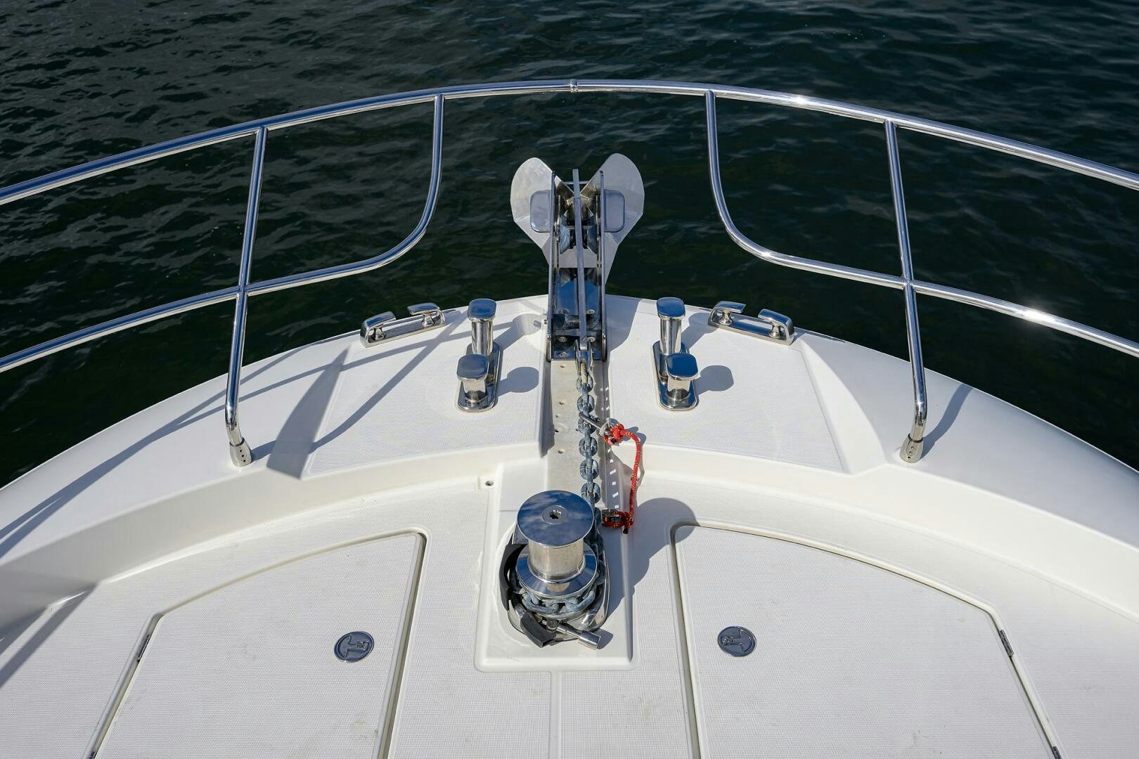a white boat with a blue hook aboard 2016 68 PRESTIGE Yacht for Sale