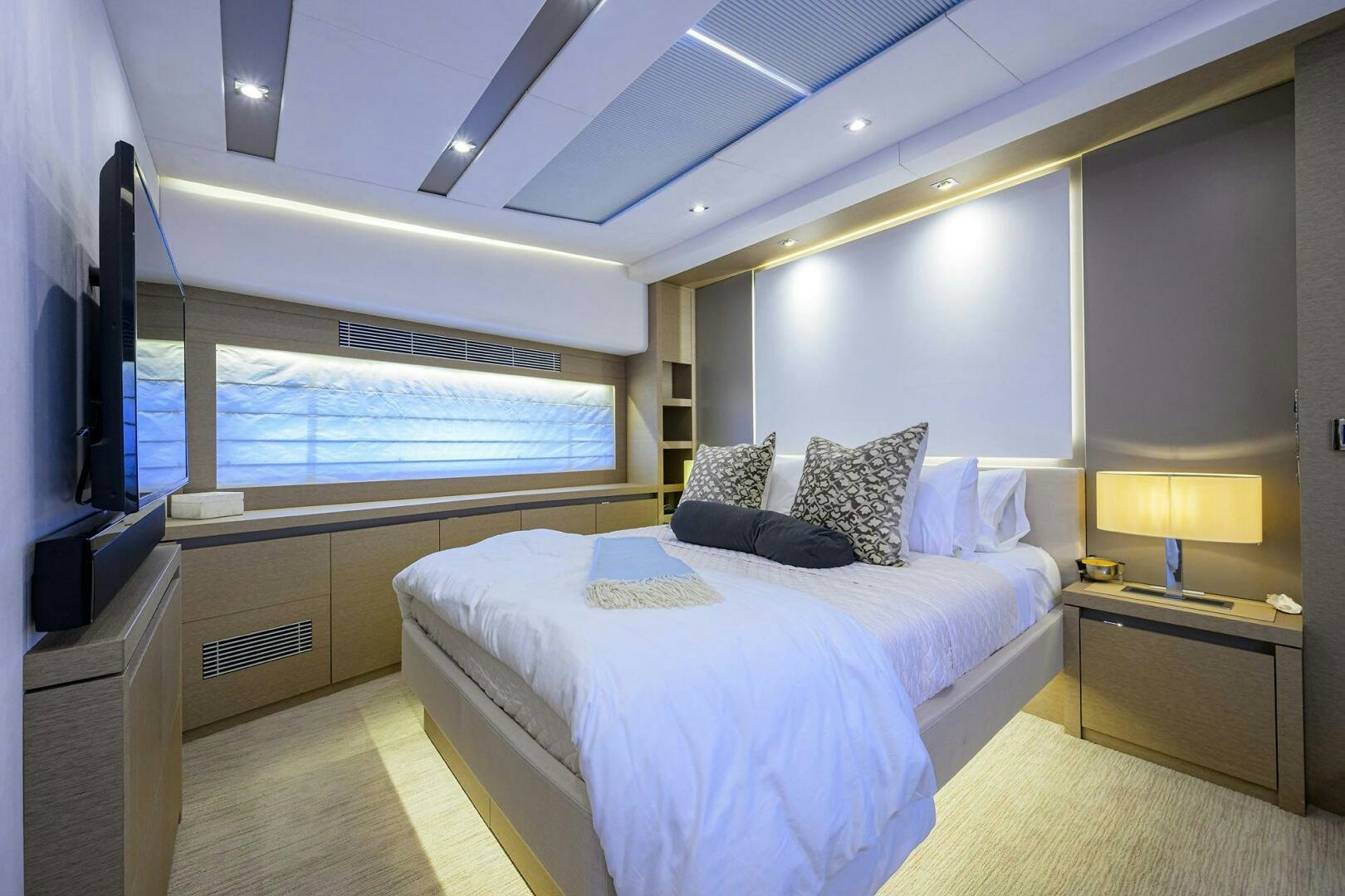 a bedroom with a large bed aboard 2016 68 PRESTIGE Yacht for Sale