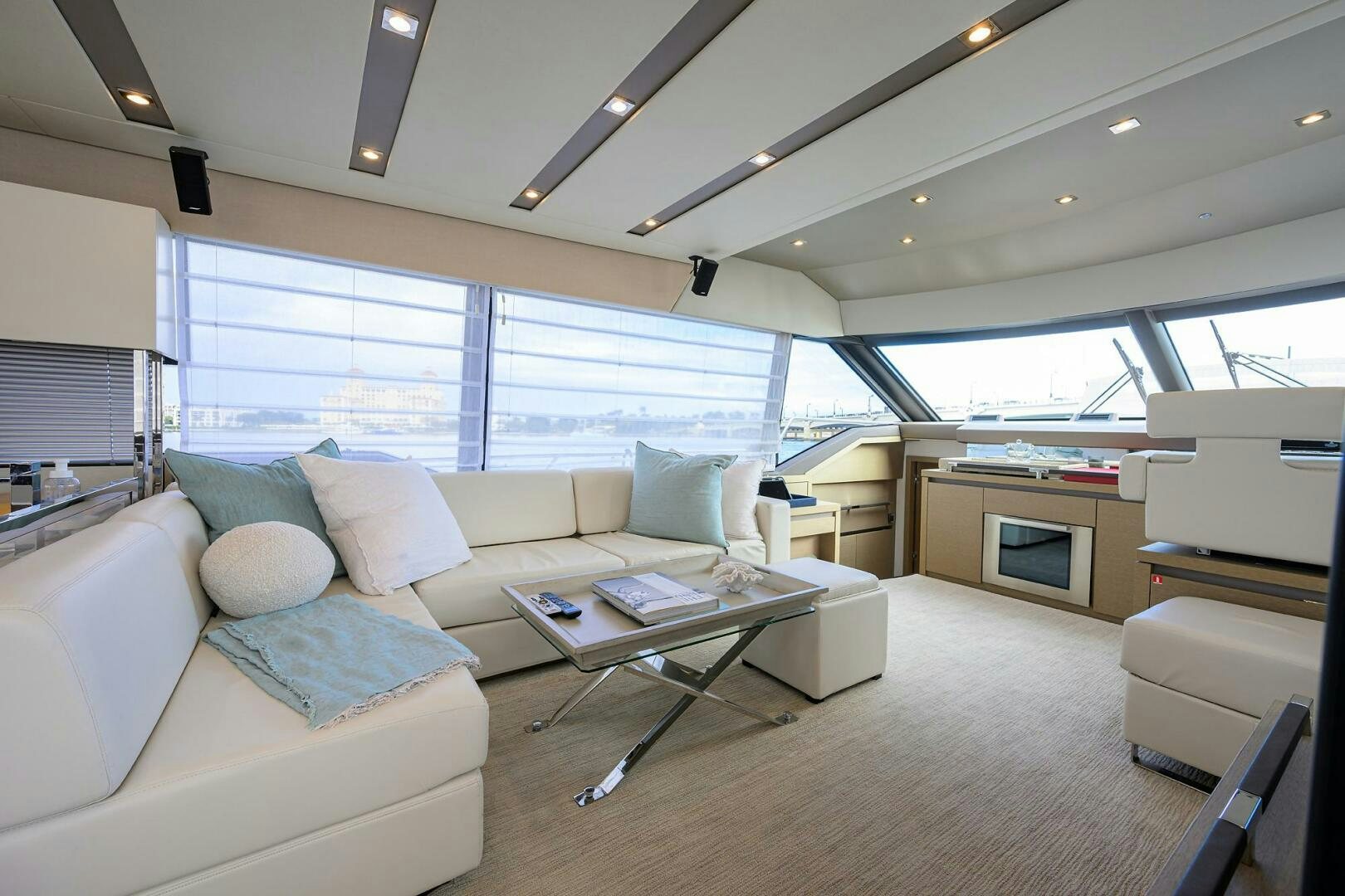 a living room with a couch and a table aboard 2016 68 PRESTIGE Yacht for Sale