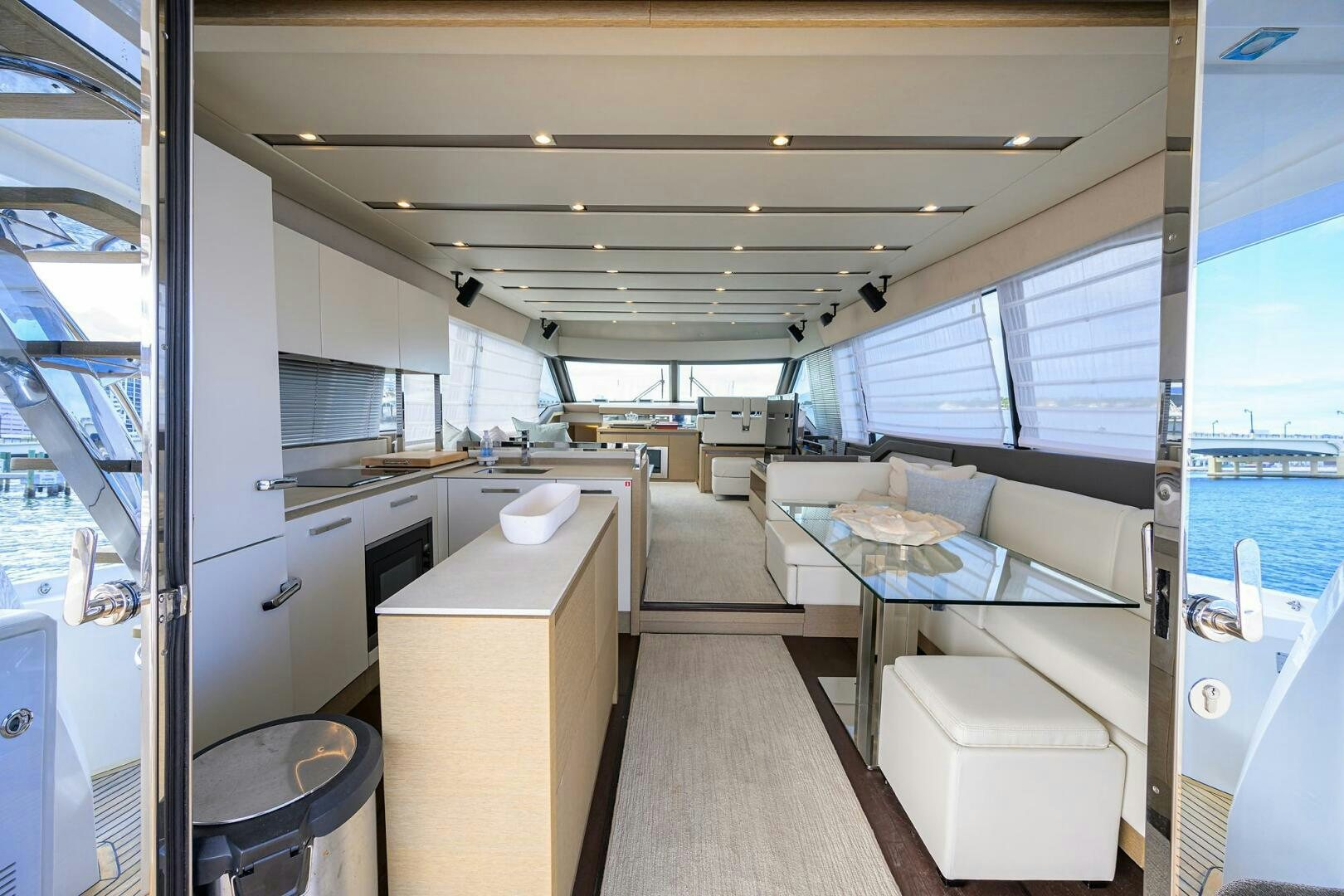 a room with a bed and a desk aboard 2016 68 PRESTIGE Yacht for Sale
