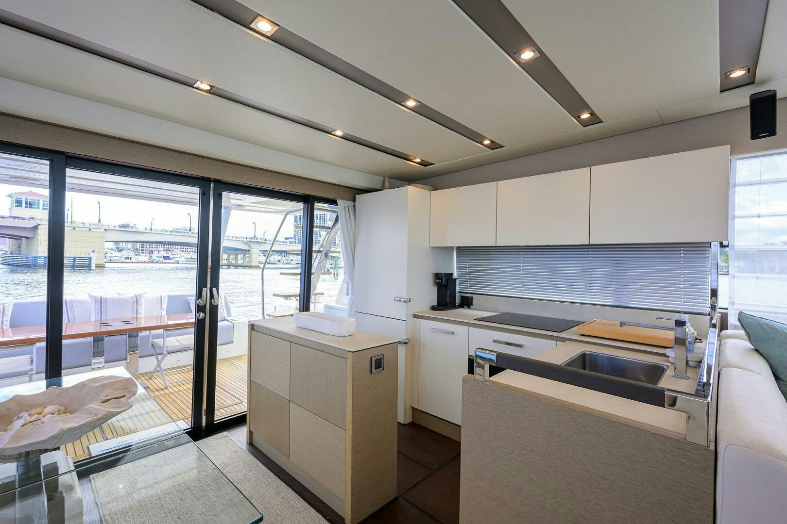a kitchen with a large window aboard 2016 68 PRESTIGE Yacht for Sale