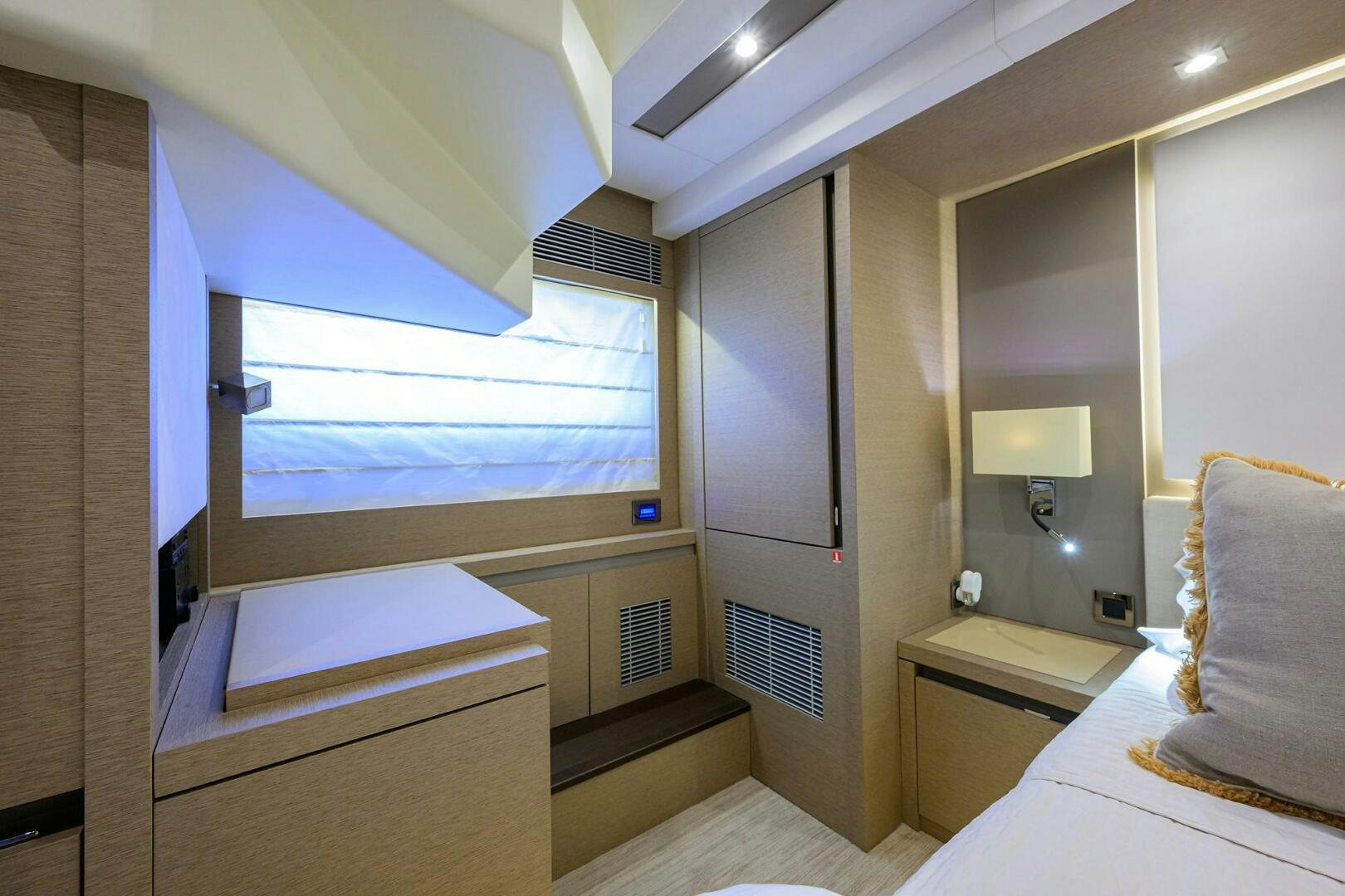 a room with a bed and a desk aboard 2016 68 PRESTIGE Yacht for Sale