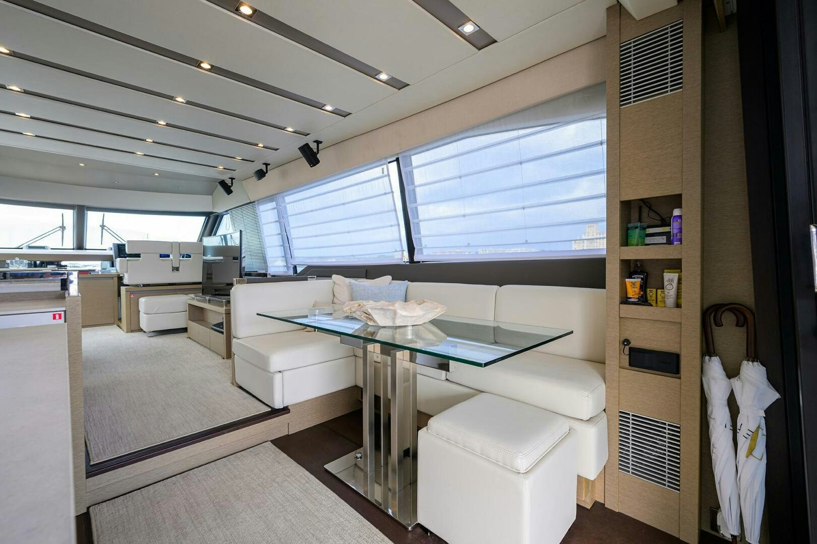 a room with a table and chairs aboard 2016 68 PRESTIGE Yacht for Sale