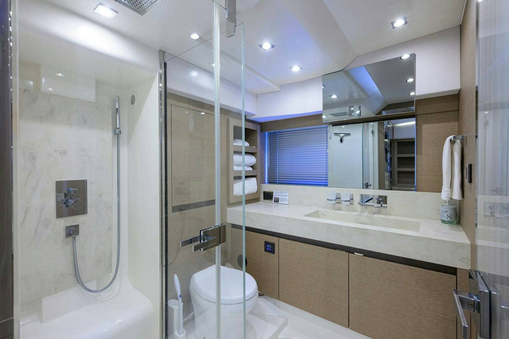 a bathroom with a standup shower aboard 2016 68 PRESTIGE Yacht for Sale