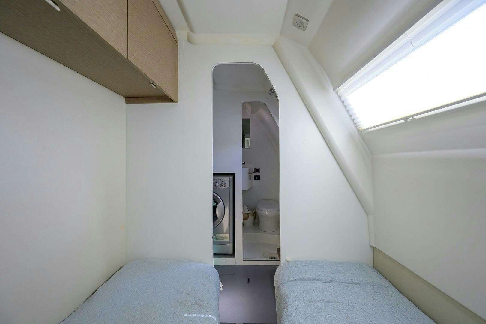 a small room with a bed and a toilet aboard 2016 68 PRESTIGE Yacht for Sale