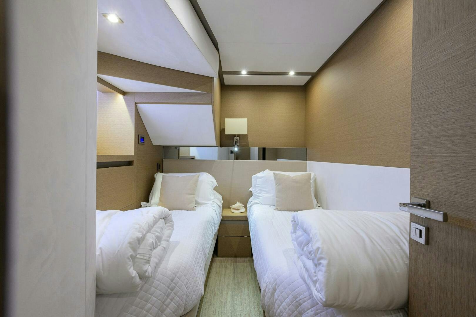 a room with two beds aboard 2016 68 PRESTIGE Yacht for Sale