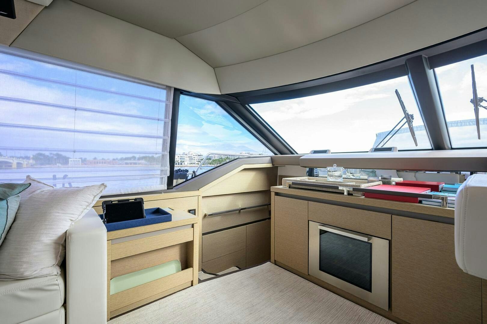 a room with a bed and a tv aboard 2016 68 PRESTIGE Yacht for Sale
