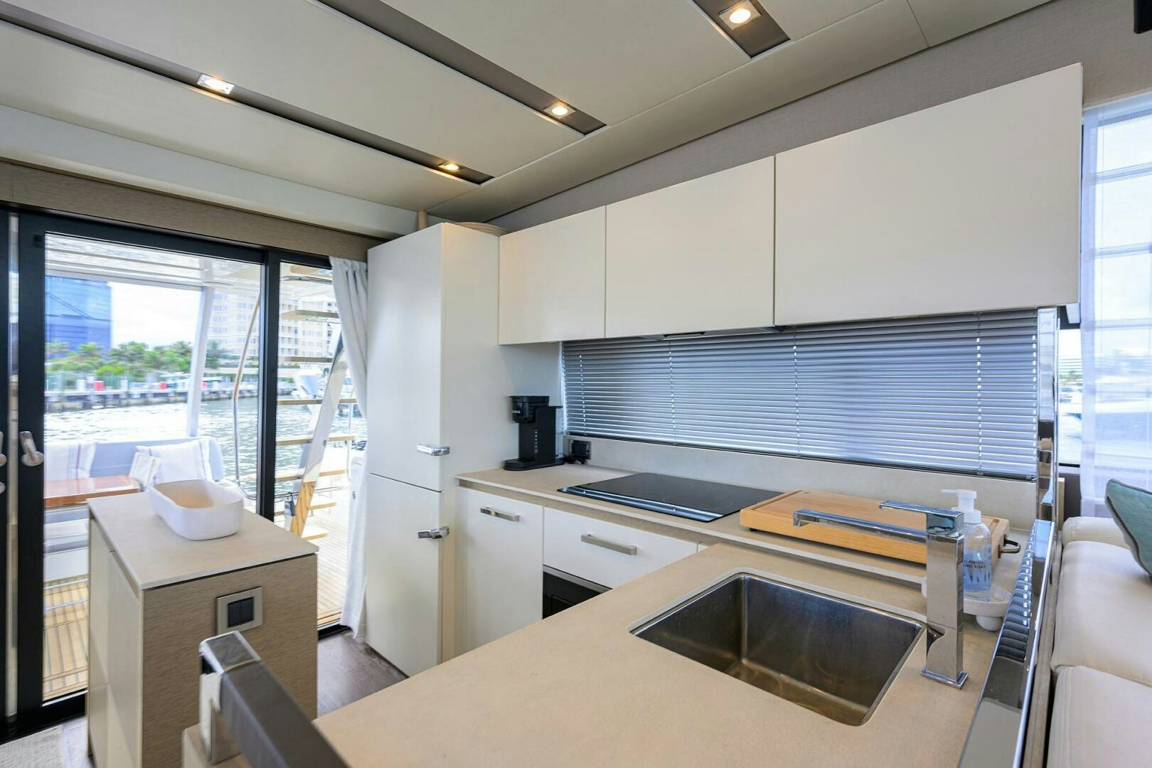 a kitchen with a sink and a window aboard 2016 68 PRESTIGE Yacht for Sale